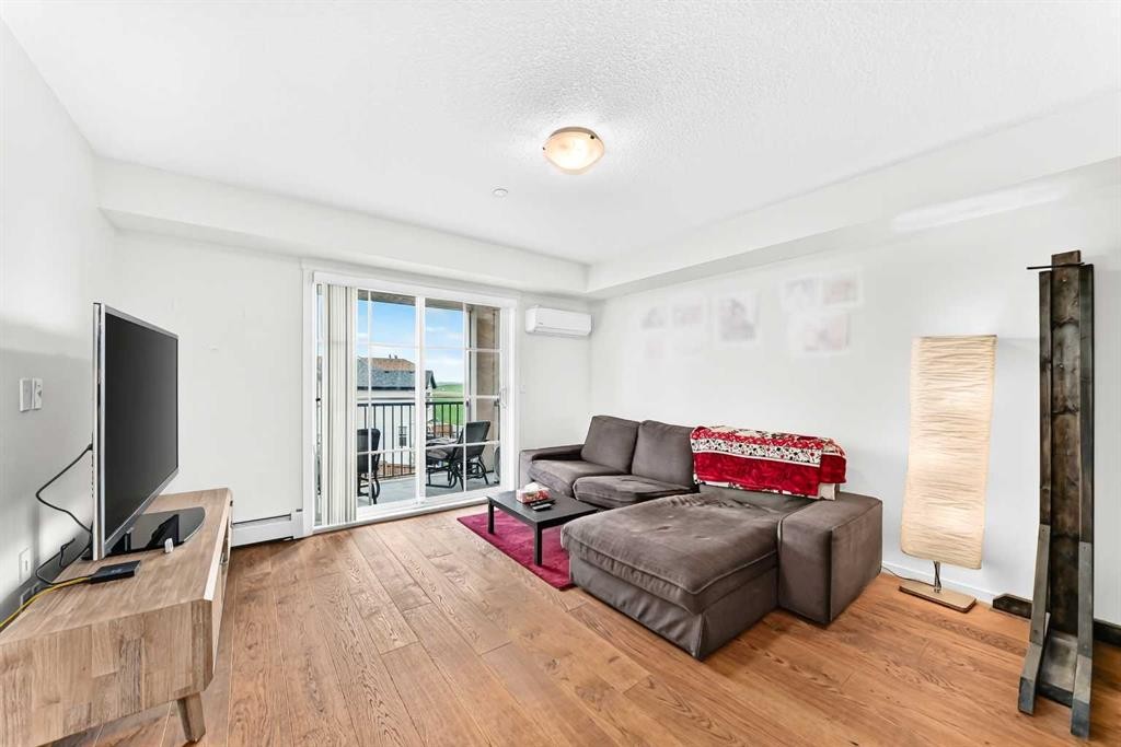4302-755 Copperpond Boulevard Se, Calgary, AB - Indoor Photo Showing Living Room