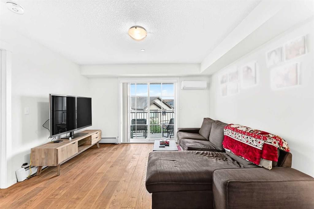 4302-755 Copperpond Boulevard Se, Calgary, AB - Indoor Photo Showing Living Room