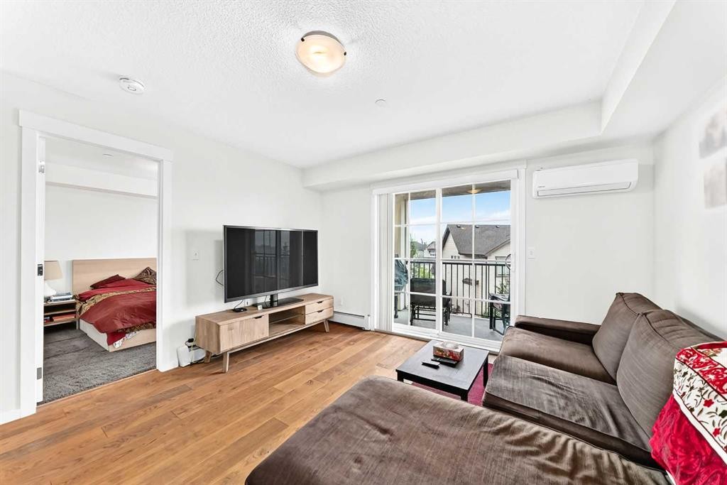 4302-755 Copperpond Boulevard Se, Calgary, AB - Indoor Photo Showing Living Room