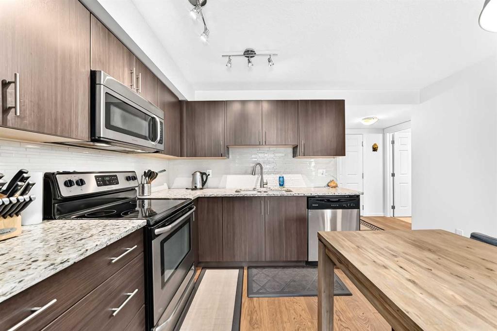 4302-755 Copperpond Boulevard Se, Calgary, AB - Indoor Photo Showing Kitchen With Upgraded Kitchen