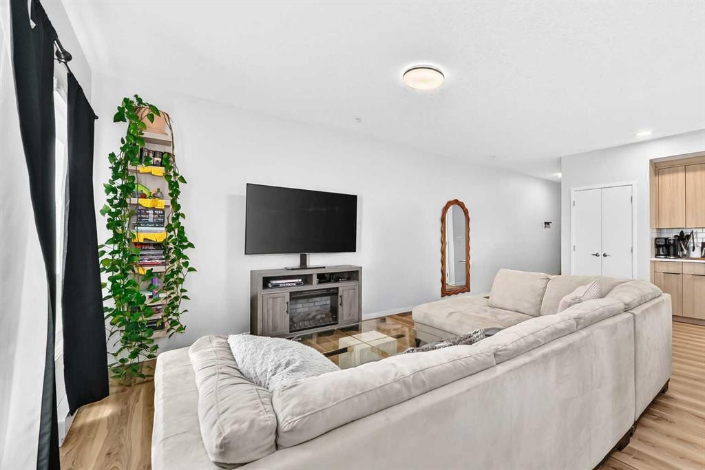 3208-220 Seton Grove Se, Calgary, AB - Indoor Photo Showing Living Room