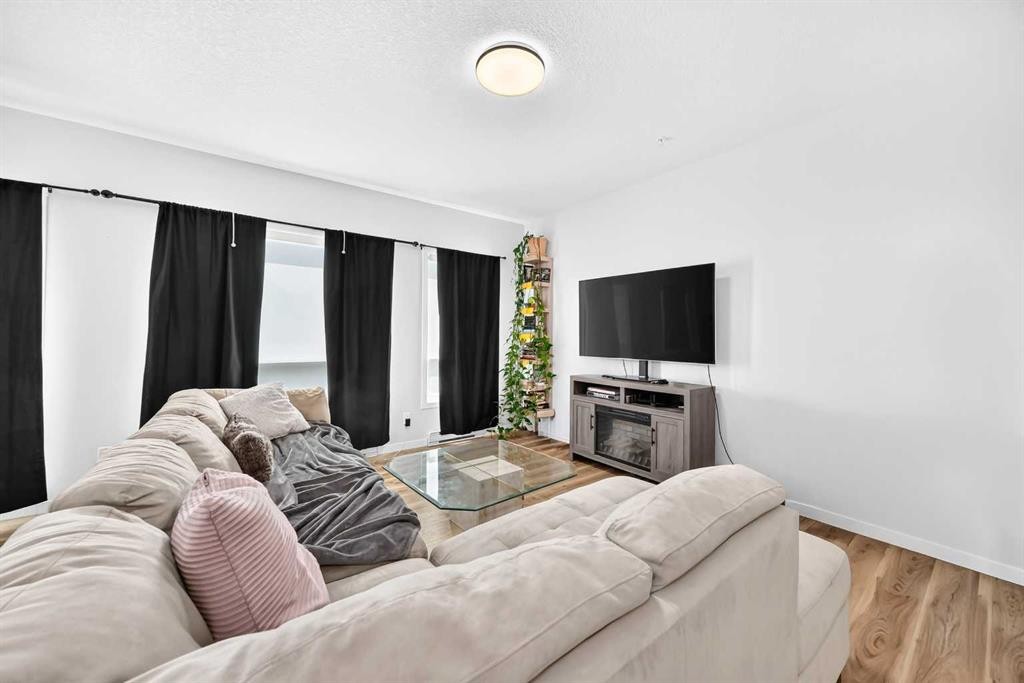 3208-220 Seton Grove Se, Calgary, AB - Indoor Photo Showing Living Room