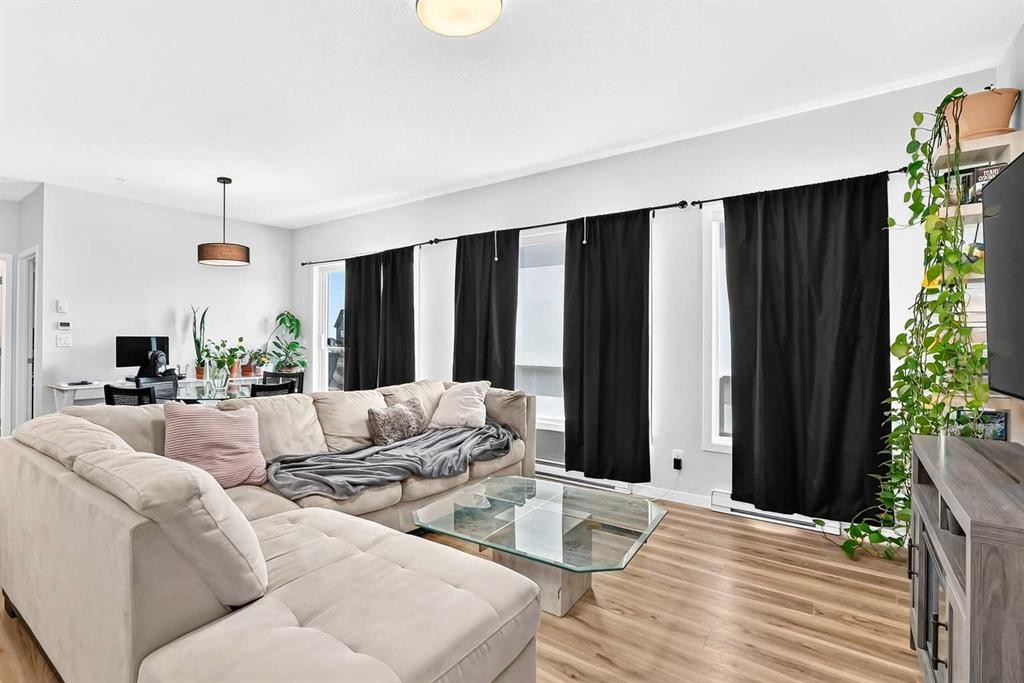 3208-220 Seton Grove Se, Calgary, AB - Indoor Photo Showing Living Room