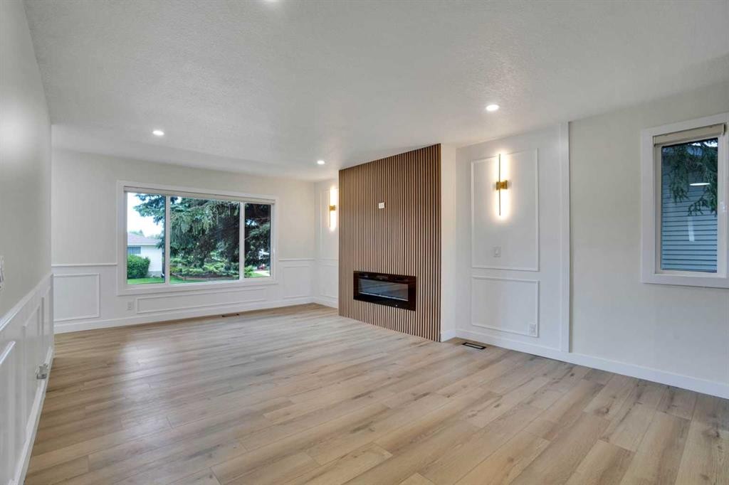1903 62 Street Ne, Calgary, AB - Indoor Photo Showing Living Room With Fireplace