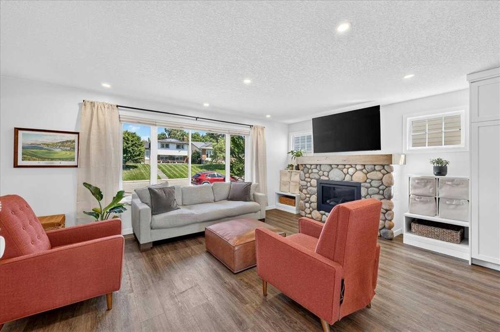 7327 Silver Springs Road Nw, Calgary, AB - Indoor Photo Showing Living Room With Fireplace