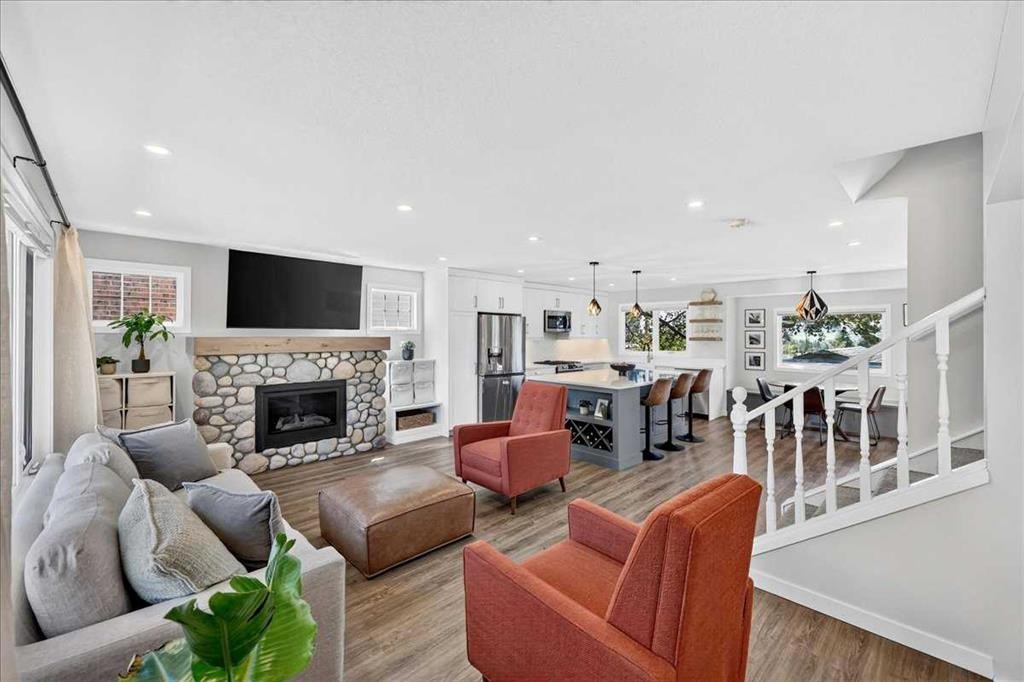 7327 Silver Springs Road Nw, Calgary, AB - Indoor Photo Showing Living Room With Fireplace