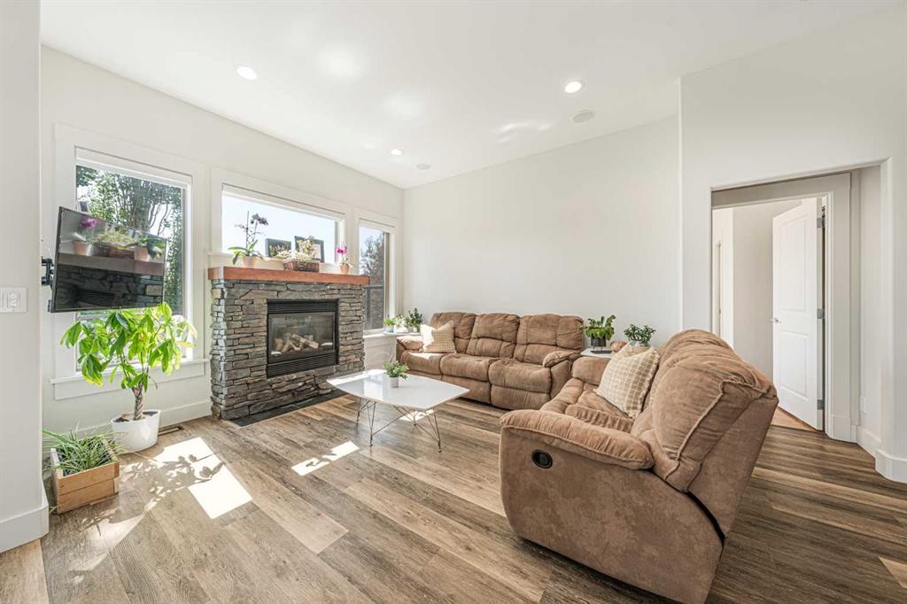 2 Discovery Ridge Heights Sw, Calgary, AB - Indoor Photo Showing Living Room With Fireplace