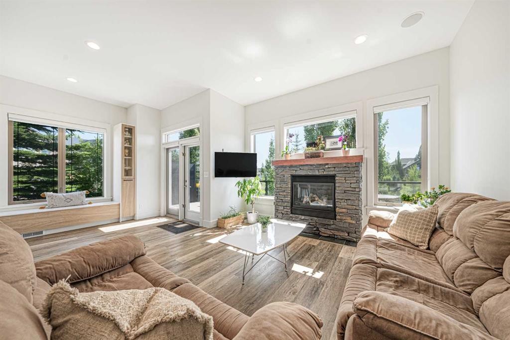 2 Discovery Ridge Heights Sw, Calgary, AB - Indoor Photo Showing Living Room With Fireplace