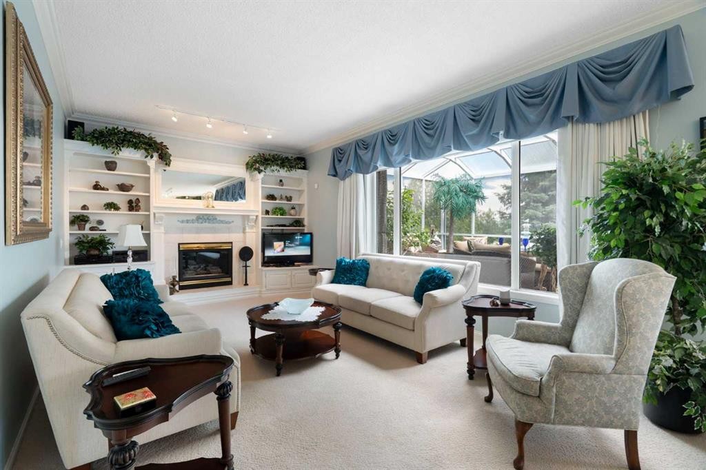 1649 Evergreen Hill Sw, Calgary, AB - Indoor Photo Showing Living Room With Fireplace