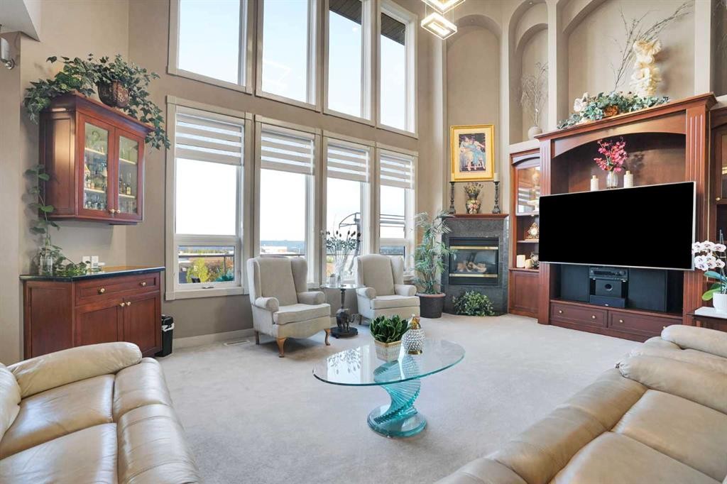 99 Arbour Vista Road Nw, Calgary, AB - Indoor Photo Showing Living Room With Fireplace