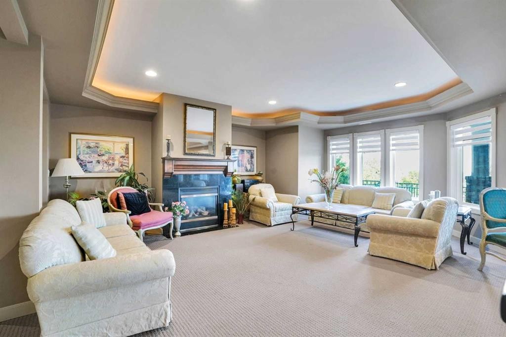99 Arbour Vista Road Nw, Calgary, AB - Indoor Photo Showing Living Room With Fireplace