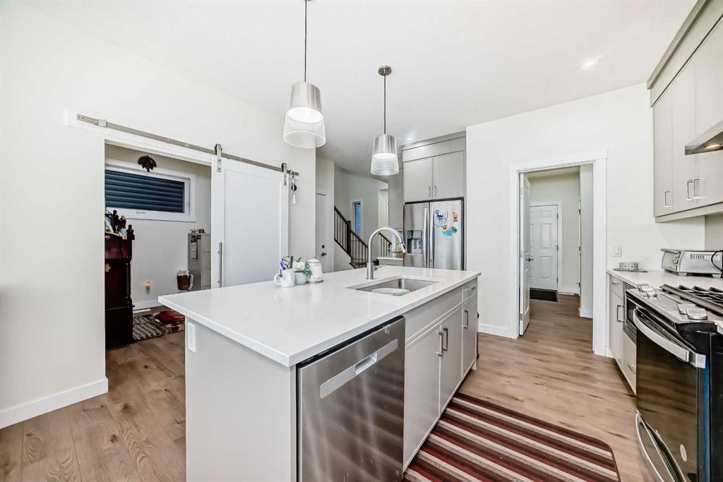 138 Silver Spruce Grove Sw, Calgary, AB - Indoor Photo Showing Kitchen With Upgraded Kitchen