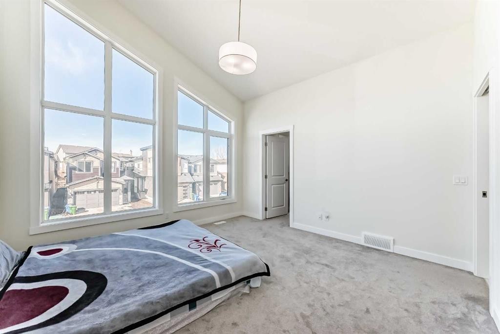 138 Silver Spruce Grove Sw, Calgary, AB - Indoor Photo Showing Bedroom