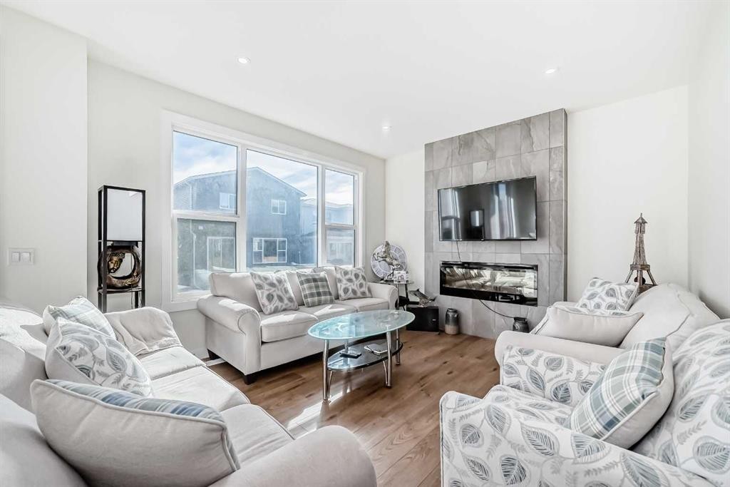 138 Silver Spruce Grove Sw, Calgary, AB - Indoor Photo Showing Living Room With Fireplace