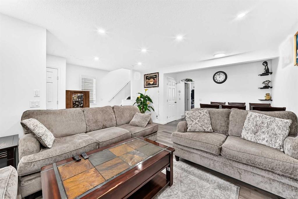 24 Taralake Road Ne, Calgary, AB - Indoor Photo Showing Living Room