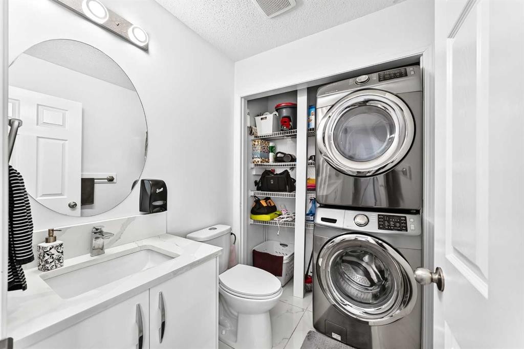 24 Taralake Road Ne, Calgary, AB - Indoor Photo Showing Laundry Room