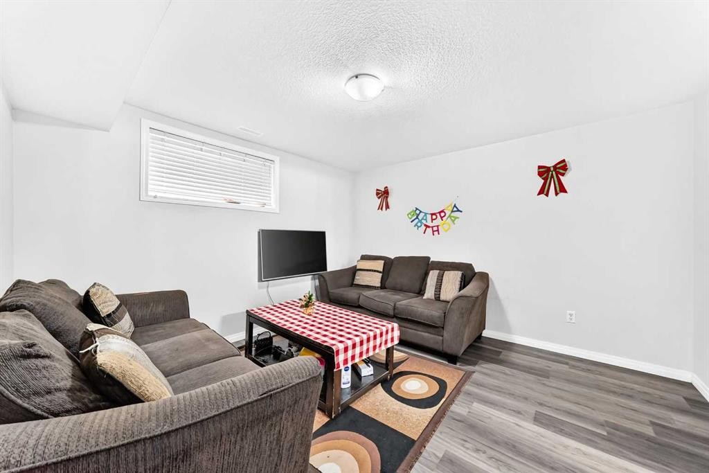 24 Taralake Road Ne, Calgary, AB - Indoor Photo Showing Living Room