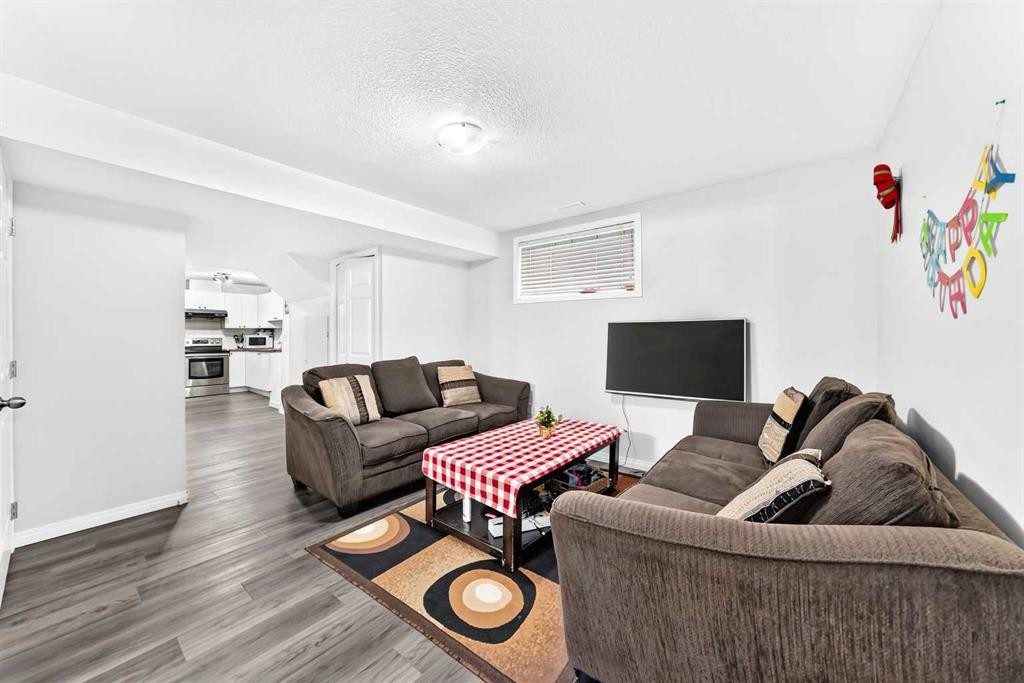 24 Taralake Road Ne, Calgary, AB - Indoor Photo Showing Living Room