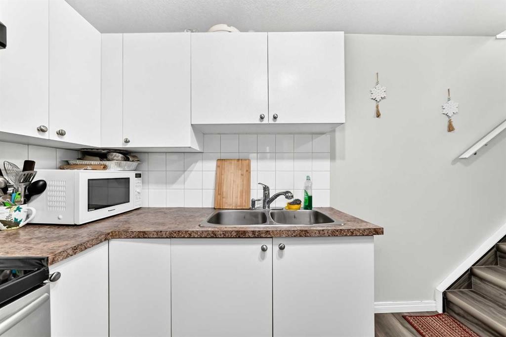 24 Taralake Road Ne, Calgary, AB - Indoor Photo Showing Kitchen With Double Sink