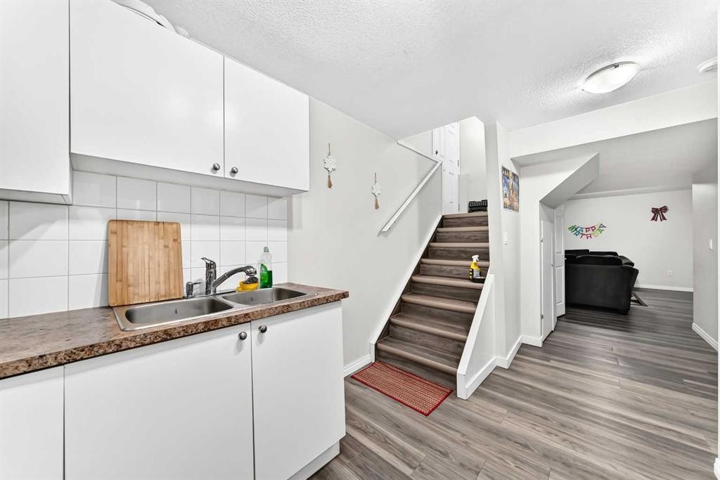 24 Taralake Road Ne, Calgary, AB - Indoor Photo Showing Kitchen With Double Sink