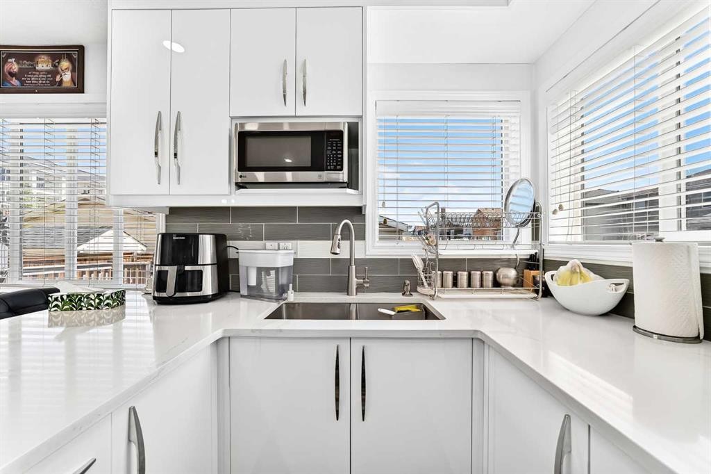 24 Taralake Road Ne, Calgary, AB - Indoor Photo Showing Kitchen With Double Sink