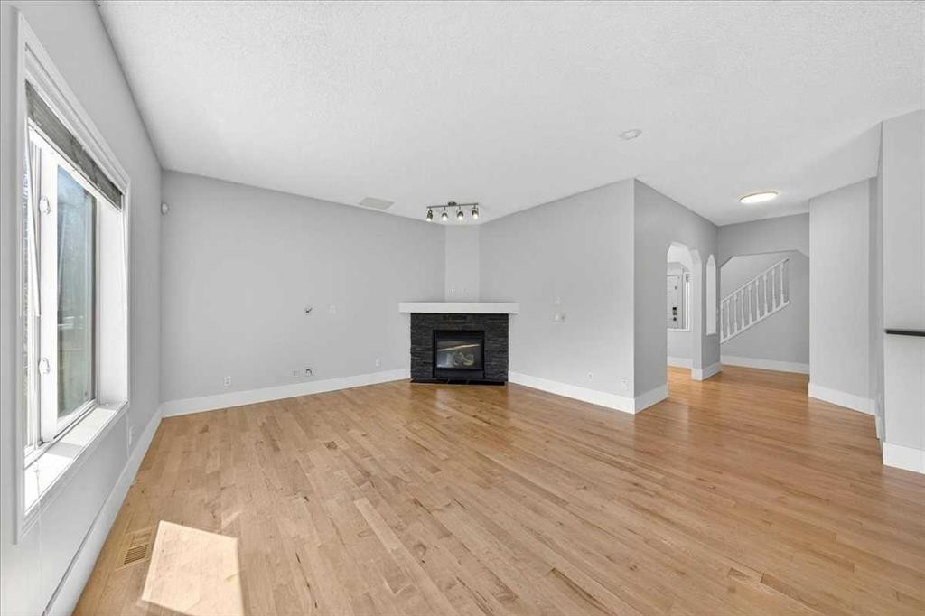 18 Cougarstone Bay Sw, Calgary, AB - Indoor With Fireplace