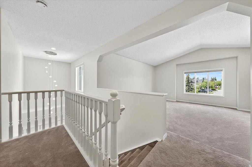 18 Cougarstone Bay Sw, Calgary, AB - Indoor Photo Showing Other Room