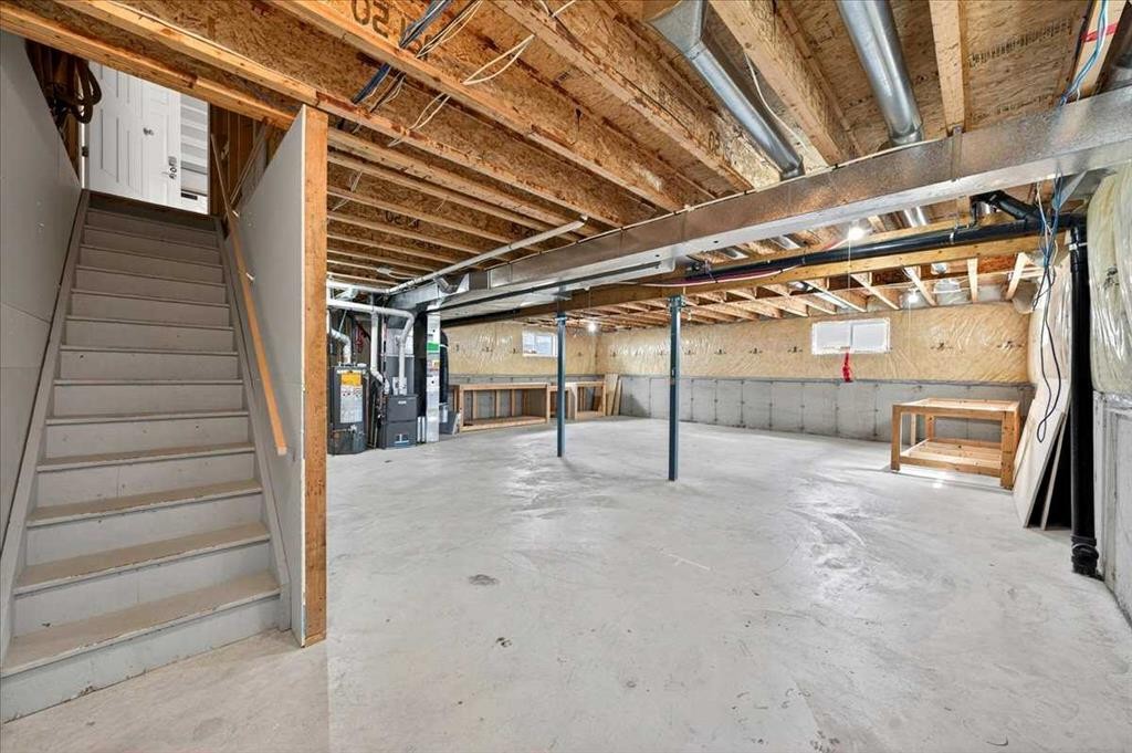 18 Cougarstone Bay Sw, Calgary, AB - Indoor Photo Showing Basement
