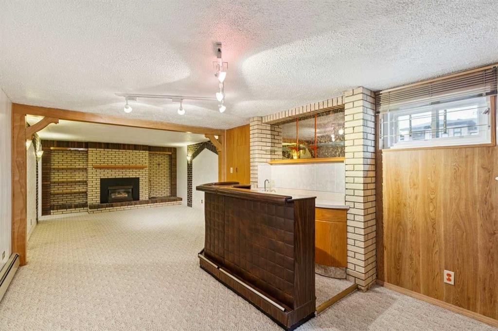 47 Montrose Crescent Ne, Calgary, AB - Indoor With Fireplace