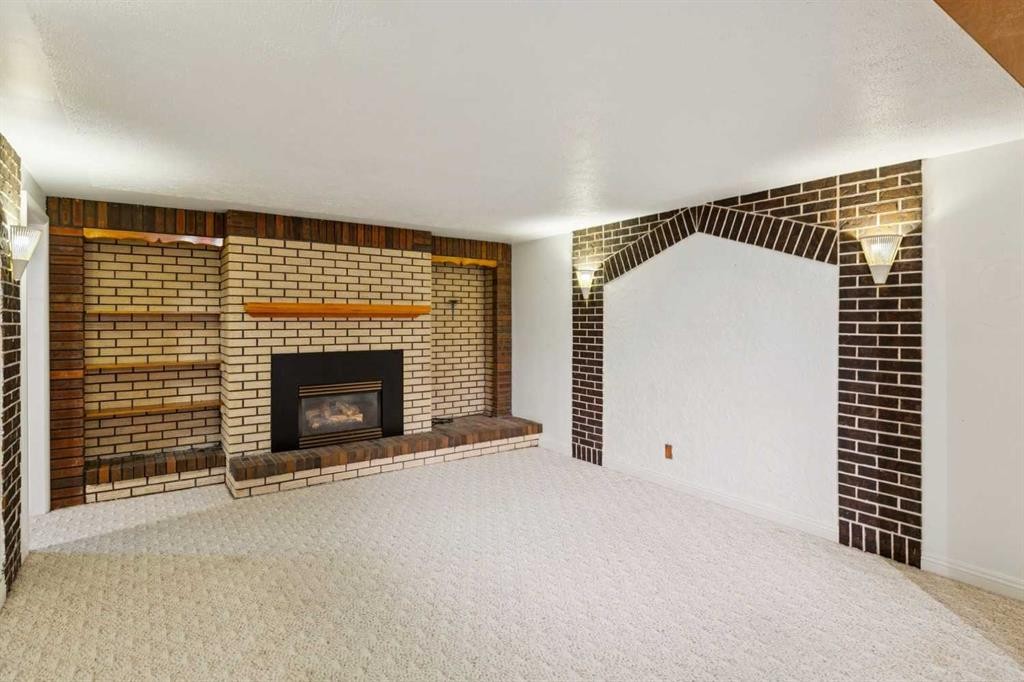 47 Montrose Crescent Ne, Calgary, AB - Indoor With Fireplace