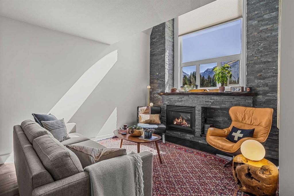 3-601 4, Canmore, AB - Indoor Photo Showing Living Room With Fireplace