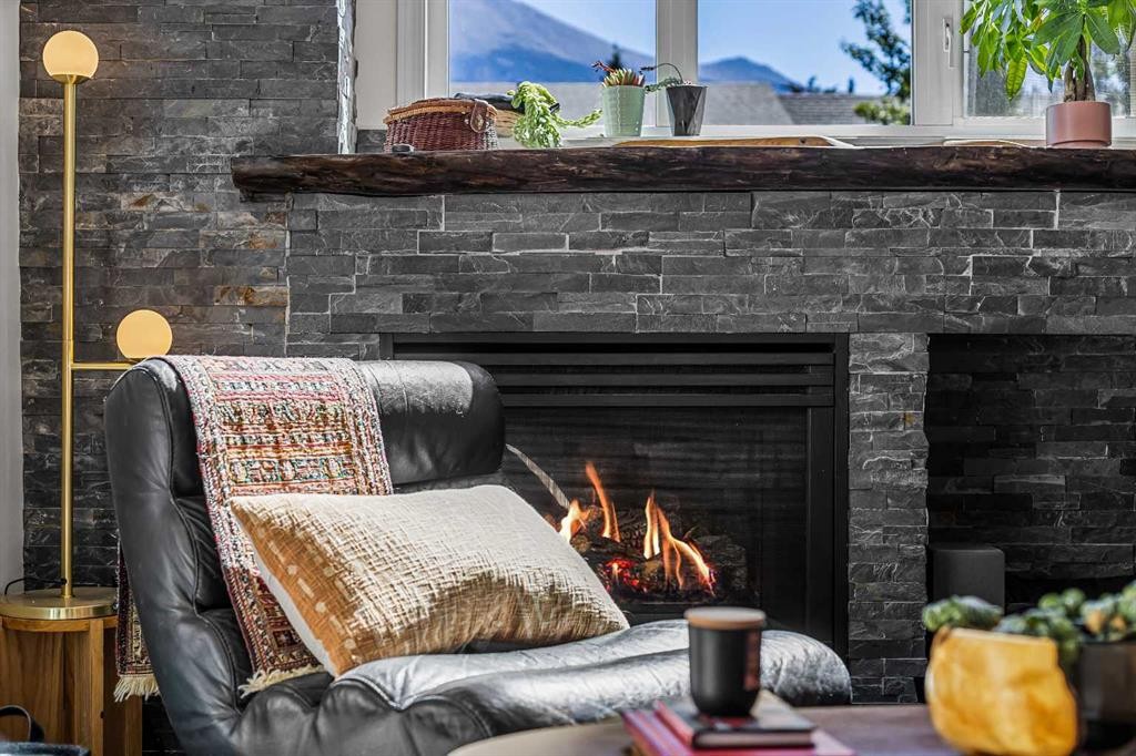 3-601 4, Canmore, AB - Indoor Photo Showing Living Room With Fireplace