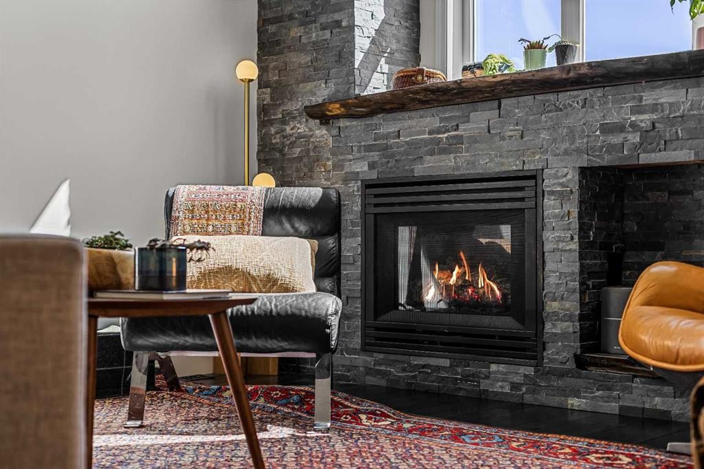 3-601 4, Canmore, AB - Indoor Photo Showing Living Room With Fireplace