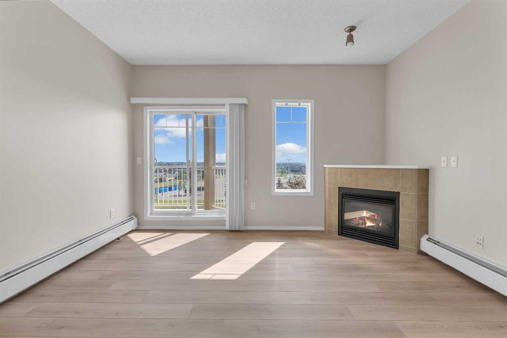 6307-70 Panamount Drive Nw, Calgary, AB - Indoor Photo Showing Living Room With Fireplace