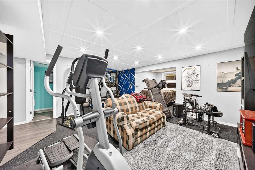 16 Sunrise Crescent, Cochrane, AB - Indoor Photo Showing Gym Room