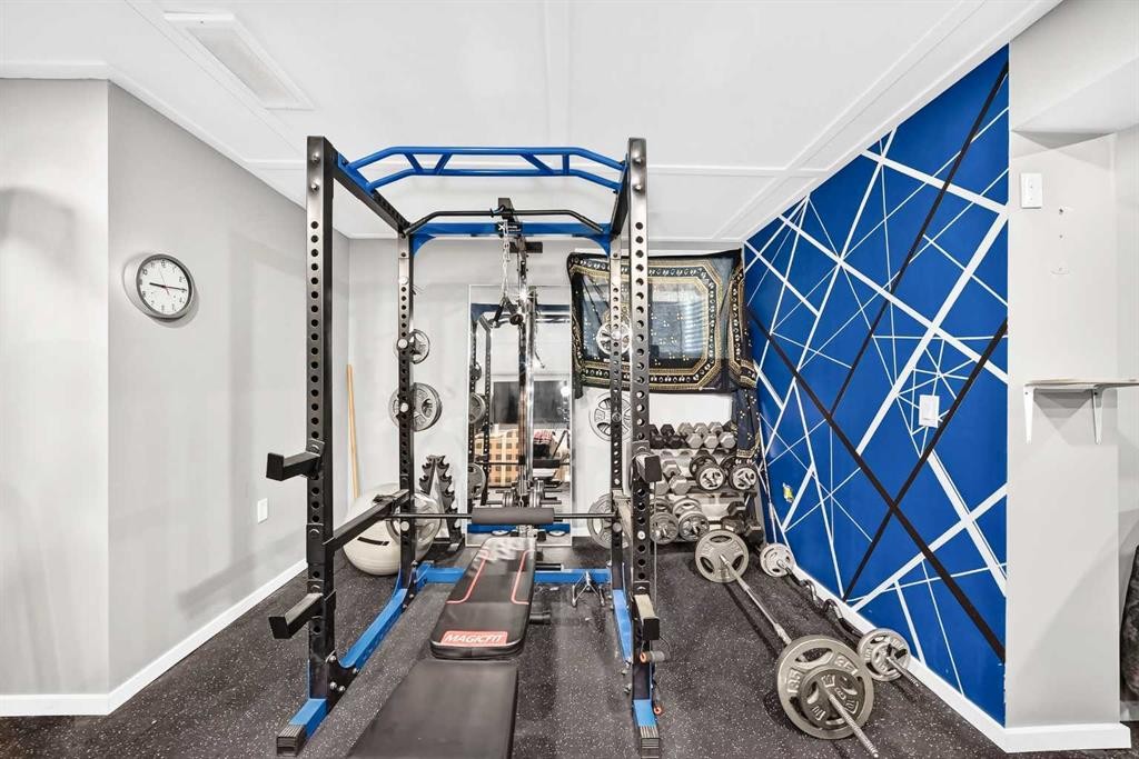 16 Sunrise Crescent, Cochrane, AB - Indoor Photo Showing Gym Room
