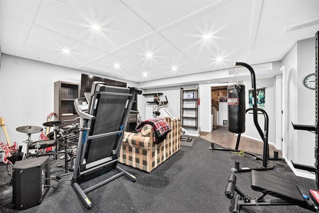 16 Sunrise Crescent, Cochrane, AB - Indoor Photo Showing Gym Room