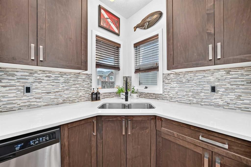 16 Sunrise Crescent, Cochrane, AB - Indoor Photo Showing Kitchen With Double Sink With Upgraded Kitchen