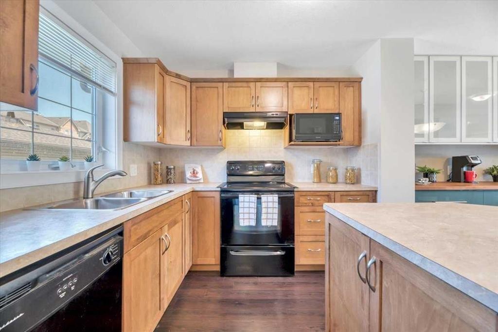 2520 Eversyde Avenue Sw, Calgary, AB - Indoor Photo Showing Kitchen With Double Sink