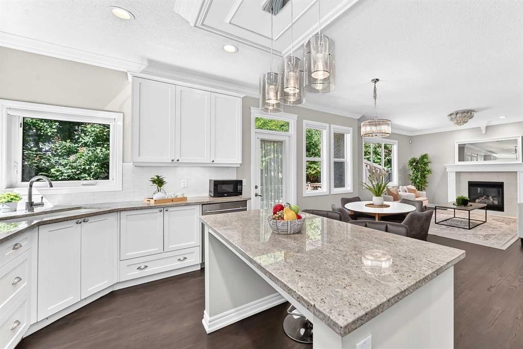 173 Aspenshire Drive Sw, Calgary, AB - Indoor Photo Showing Kitchen With Fireplace