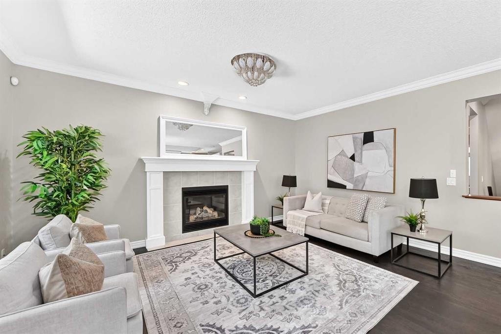 173 Aspenshire Drive Sw, Calgary, AB - Indoor Photo Showing Living Room With Fireplace