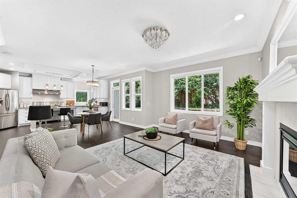 173 Aspenshire Drive Sw, Calgary, AB - Indoor Photo Showing Living Room With Fireplace