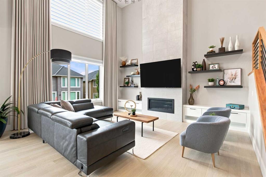 269 Aspen Summit Heights Sw, Calgary, AB - Indoor Photo Showing Living Room With Fireplace