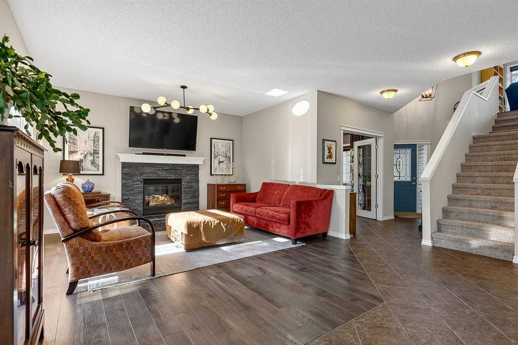 11 Chapala Square Se, Calgary, AB - Indoor Photo Showing Living Room With Fireplace