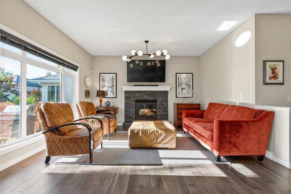 11 Chapala Square Se, Calgary, AB - Indoor Photo Showing Living Room With Fireplace