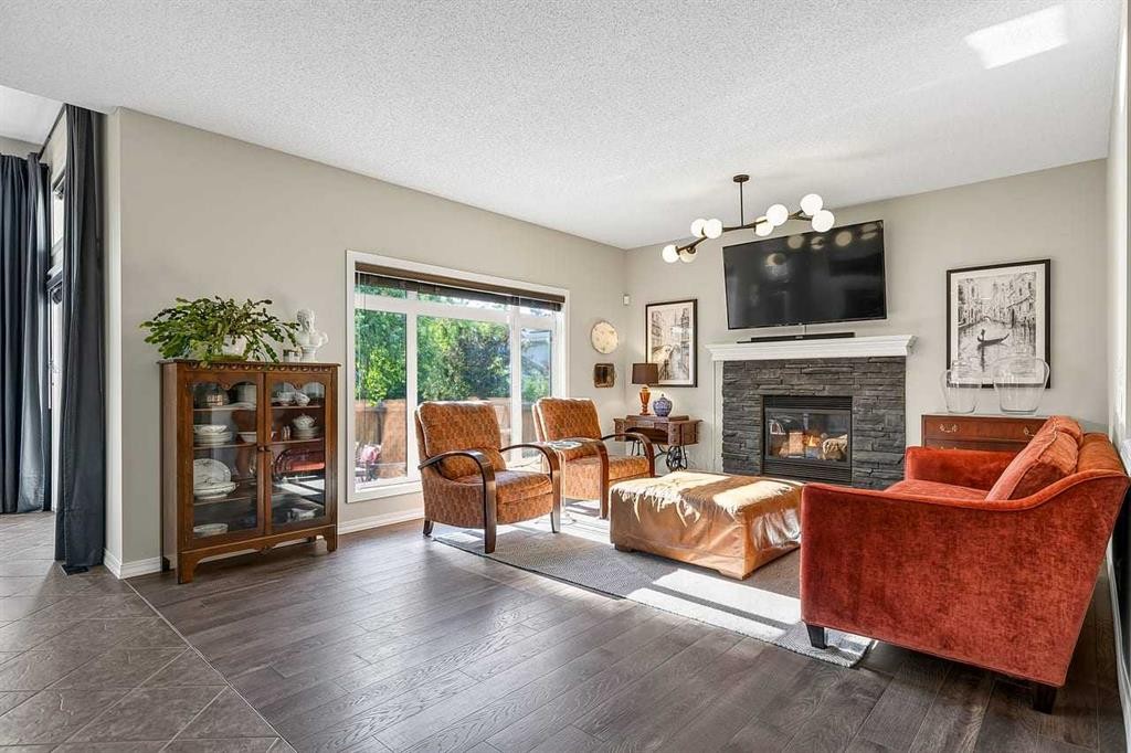 11 Chapala Square Se, Calgary, AB - Indoor Photo Showing Living Room With Fireplace