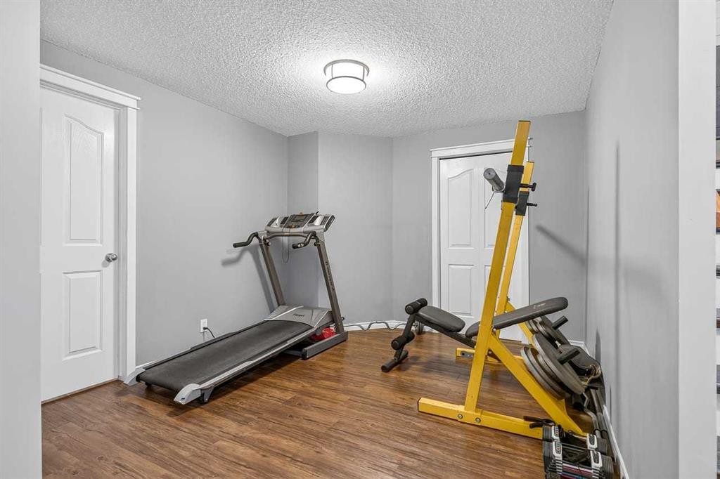 11 Chapala Square Se, Calgary, AB - Indoor Photo Showing Gym Room