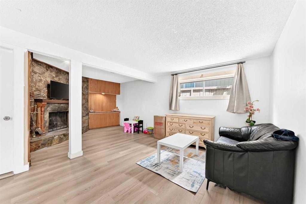 11 Bedford Drive Ne, Calgary, AB - Indoor Photo Showing Living Room With Fireplace