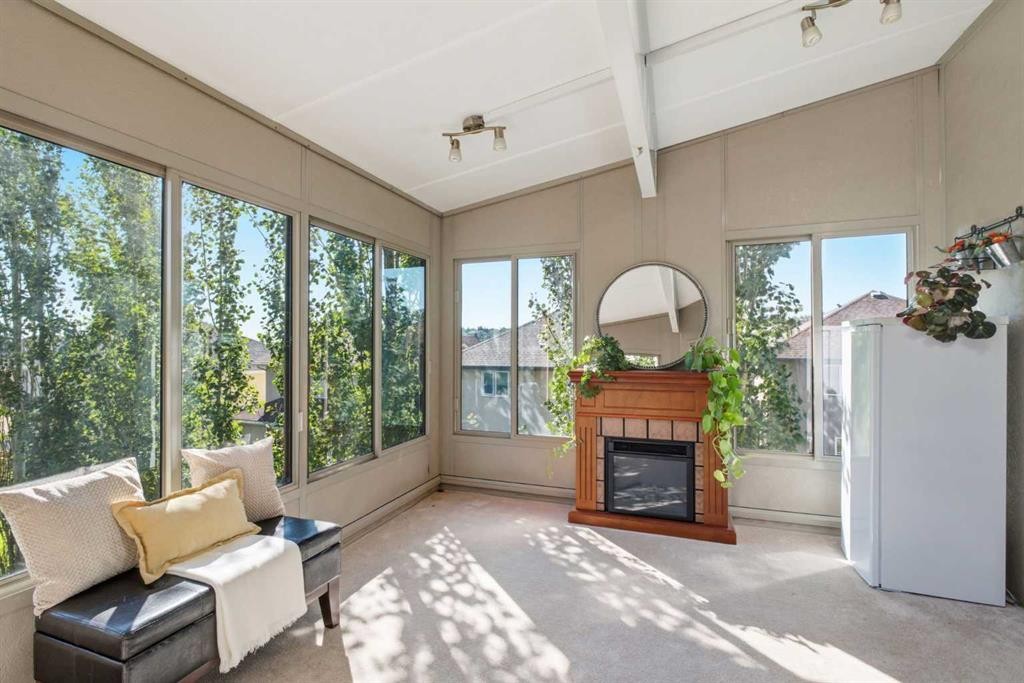 12 Edgeridge Green Nw, Calgary, AB - Indoor Photo Showing Living Room With Fireplace