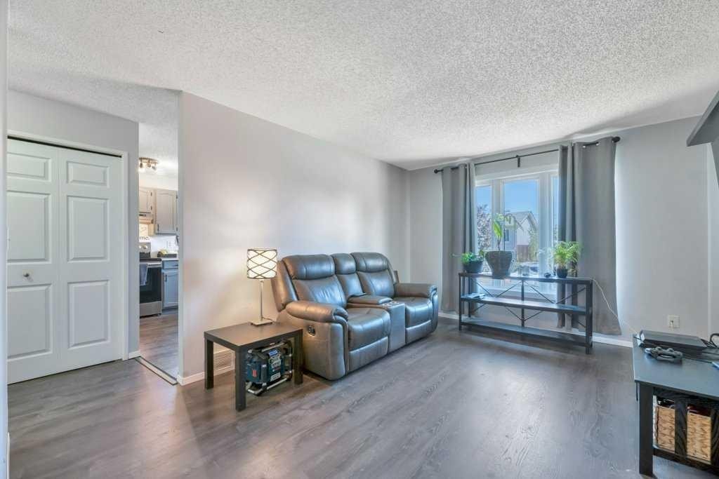 23 Abbercove Road Se, Calgary, AB - Indoor Photo Showing Living Room